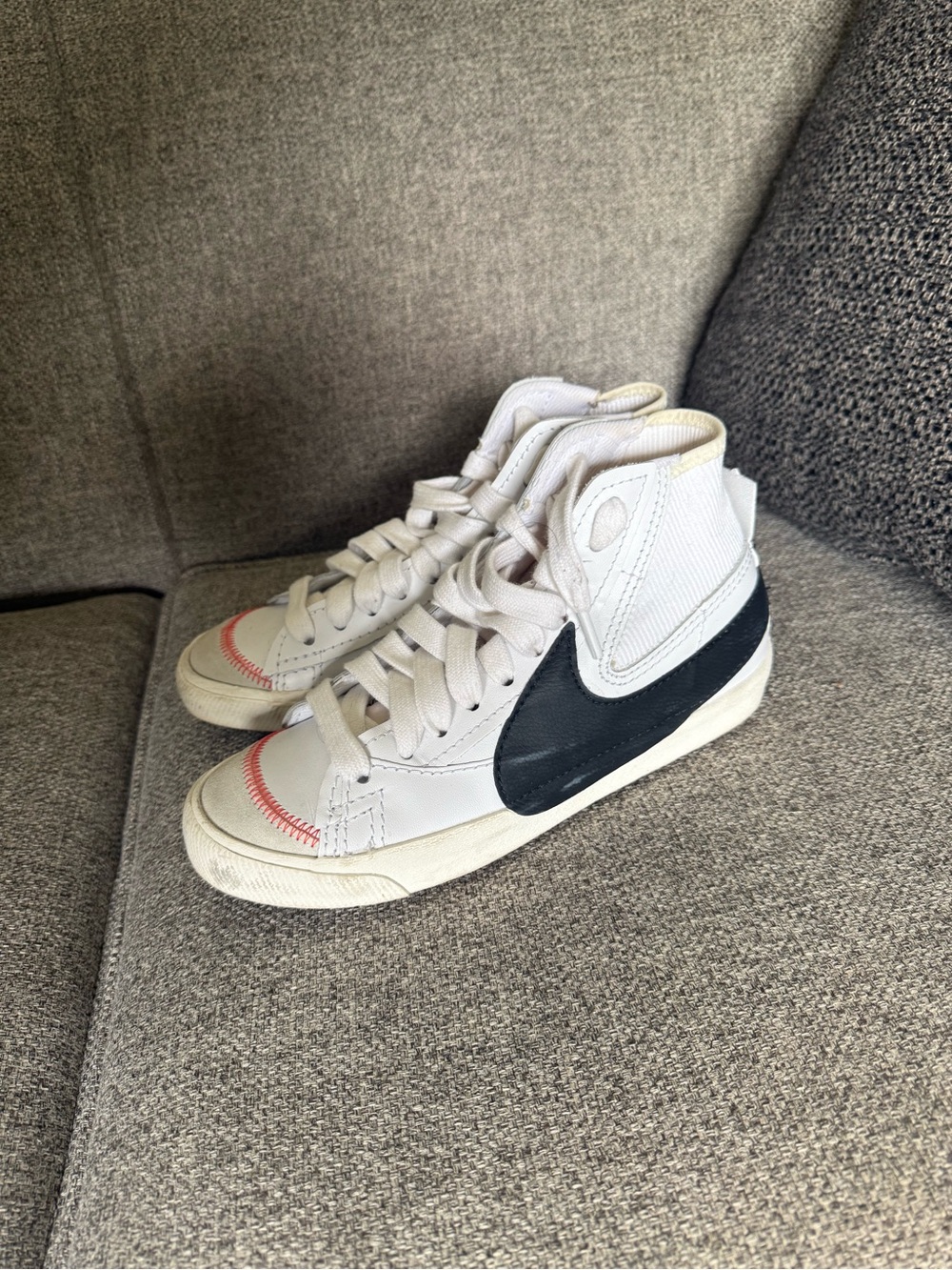 Nike Mid-Top Sneakers in White with Black Swoosh and Red Stitching